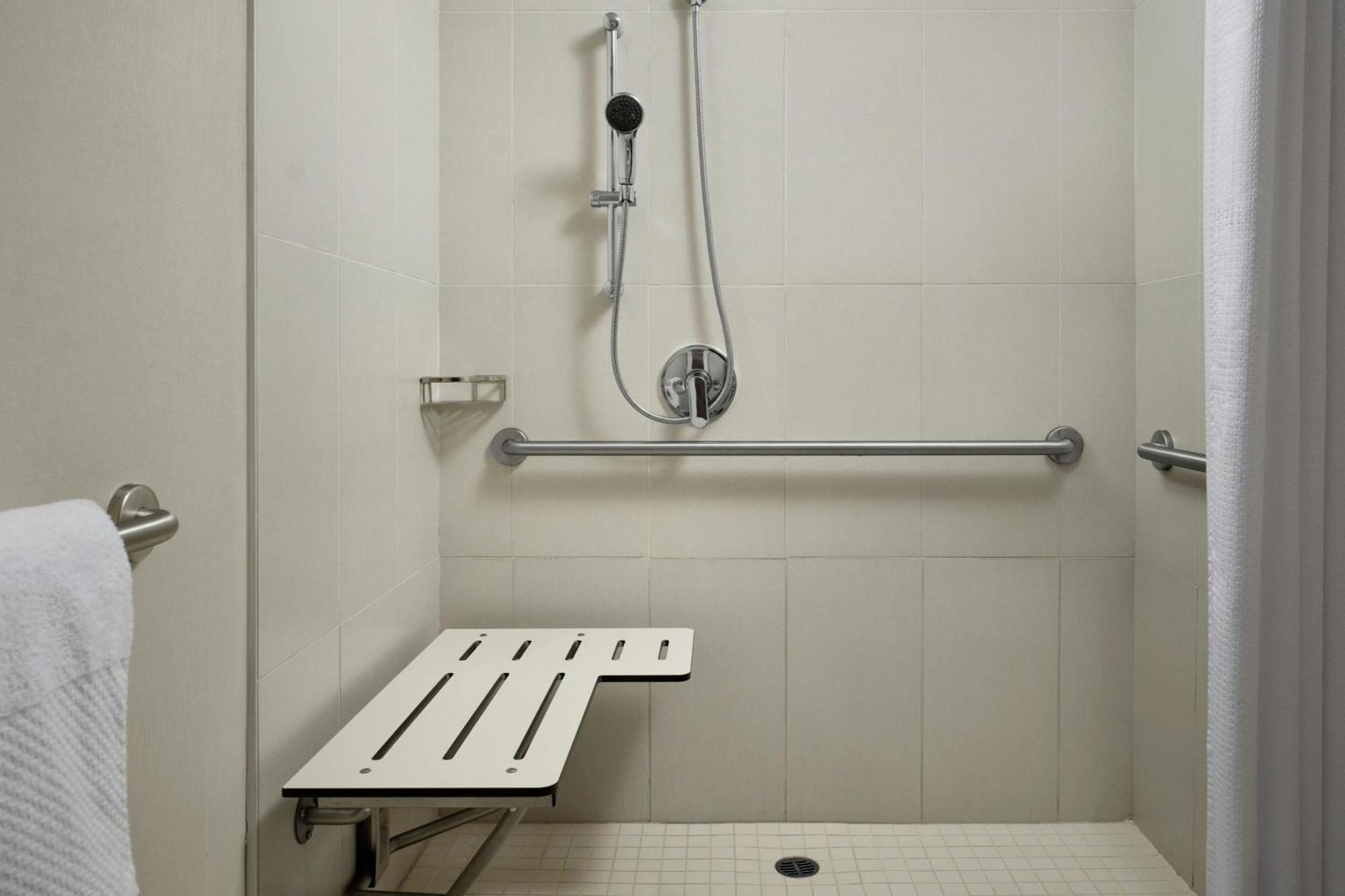 One-Bedroom Family Suite One King Bed Two Single Beds Roll Shower or Mobility Hearing Accessible